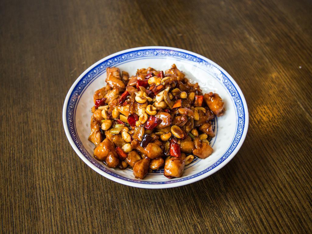 Kung Pao Chicken · Dice chicken stir fried with peanut, dried chili pepper, and garlic. Spicy. Rice not included. 