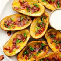 Potato Skins  · Baked potatoes topped with cheddar cheese, bacon, and chives, served with sour cream. 