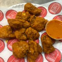 10 Boneless Wings · Cooked wing of a chicken coated in sauce or seasoning.