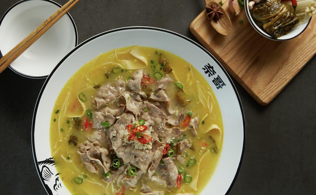 Golden Soup with Fatty Beef (酸辣金汤肥牛) · Pickling hot peppers creates the classic's more spicy-and-sour yellow cousin. Topped with fatty beef for a balanced textural bite. Heat level: 3.