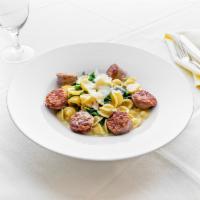 Orrechiette & Sausage Dinner · Italian sweet sausage with broccoli rabe in a white wine garlic herb broth.