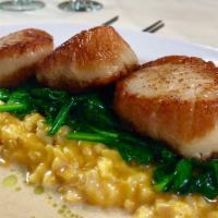 Seared Seasonal Scallops · Butternut squash risotto and sautéed spinach, finished with a brown butter emulsion 