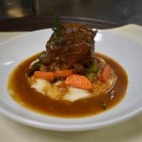 Sicilian Braised Short Ribs · Braised in a Madeira-plum tomato sauce and served with mashed potatoes, roasted brussels spr...