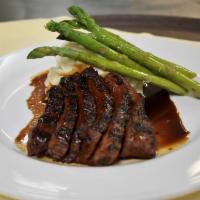 Grilled Flat Iron Steak Teriyaki · Served with whipped potatoes and asparagus 