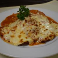 Chicken Parmigiana · With house made Linguine, Pomodoro, and topped with melted mozzarella