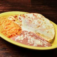Quesadilla Espinacas · A flour tortilla stuffed with cheese and spinach. Served with rice and beans.