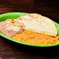 Quesadilla Rapida · Filled with shredded chicken or beef and topped with cheese sauce. Served with rice and beans.