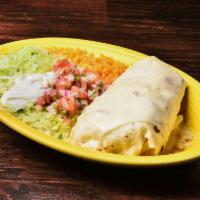 Fajita Burrito · A large flour tortilla filled with steak or chicken cooked with tomato, onion and bell peppe...