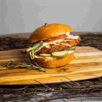 Spicy Fried Chicken Sandwich · Hot stuff. Crispy fried chicken, sliced tomatoes, lettuce, and hot sauce