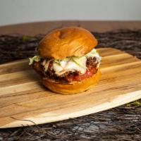 Fried Chicken Parmesan Sandwich · Best of the barnyard- chicken parmesan sandwich topped with mozzarella cheese and marinara s...