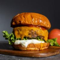 Cheese Burger · Beef patty, lettuce, tomato, onion, mayo, and melted cheddar cheese on a warm classic bun