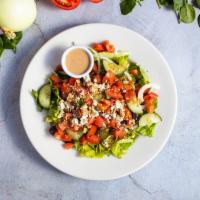 Bongo’s House Salad · Spring mix topped with cucumber, onion, and tomato. Your choice of dressing