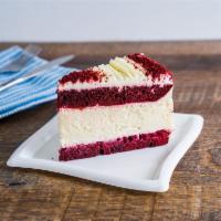 Red Velvet Cheesecake  Slice · This large Red Velvet Cheesecake has layers of moist red velvet cake and creamy cheesecake, ...