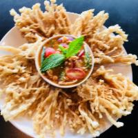 12. Deep Fried Enoki Mushroom · Battered enoki mushrooms deep fried and served with sweet chili sauce with lime juice, mint,...