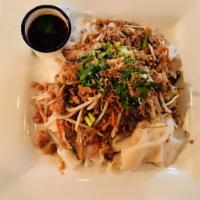 Yes Siam Noodle · Steamed wide rice noodle with fried tofu, ground chicken, shitake mushroom, shred carrot, dr...