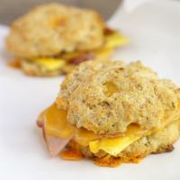 Cheddar Garlic Biscuit Sandwich · scrambled egg, garlic herb spread, ham or bacon and your choice of cheese
