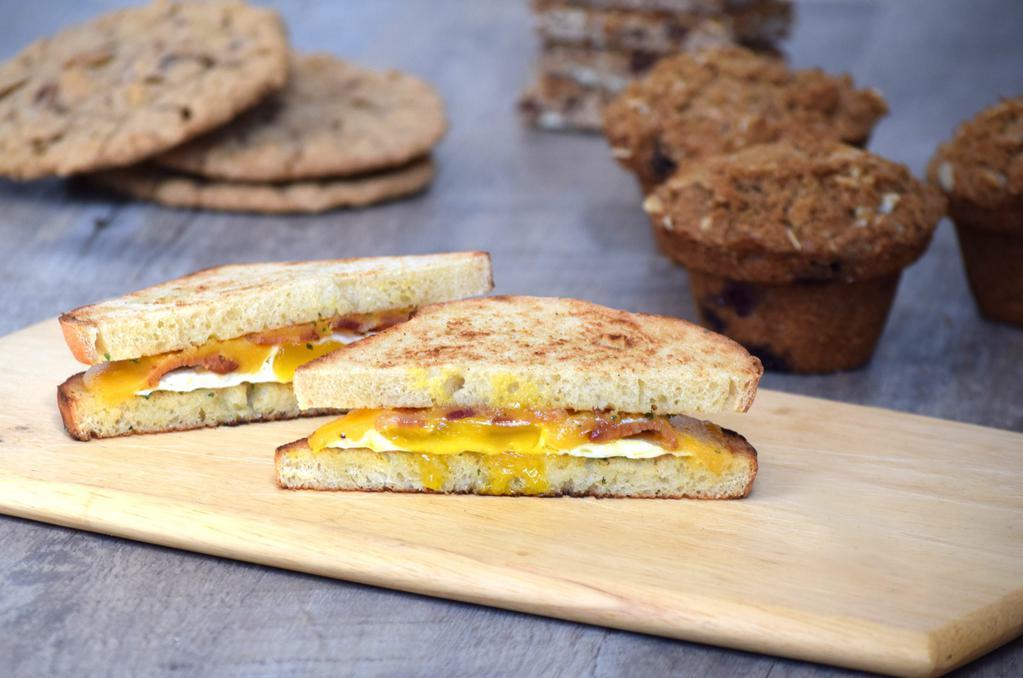 Classic Bacon Egg and Cheese · Bacon, cheddar cheese, egg and garlic herb spread on your choice of bread.  Bread Choices: roll, biscuit, honey whole wheat bread, sour dough, white bread, cheddar garlic bread.
