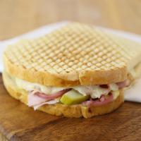 Cubano · Sliced turkey, ham, Swiss cheese, sliced dill pickles with our special house-made pickled re...