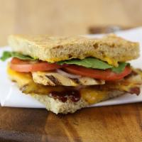 BBQ Chicken Cheddar Melt · Grilled chicken breast, bacon, BBQ sauce, melted cheddar cheese topped with lettuce, tomato,...