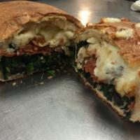 Spinach, Pepperoni, Cheese, and Olive Calzone · 