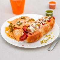 Sonoran Hotdogs · Sausage rolled in bacon and topped with pinto beans, ketchup, mustard, diced tomatoes, onion...