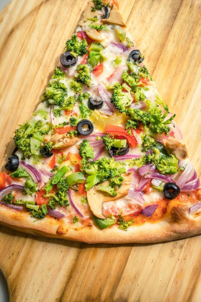 Vegetarian Pizza · Fresh grilled mushrooms, olives, onions, broccoli and tomatoes.