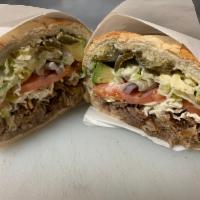 Tortas · Filled with lettuce tomato onion avocado jalapeño mayonnaise Mexican cheese refried beans 