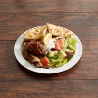 Souvlaki and Salad Meal · Salad and pita.