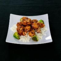 47. Sesame Chicken · Chunks of chicken sauteed in sweet sauce with sesame topping. Served with broccoli on the si...