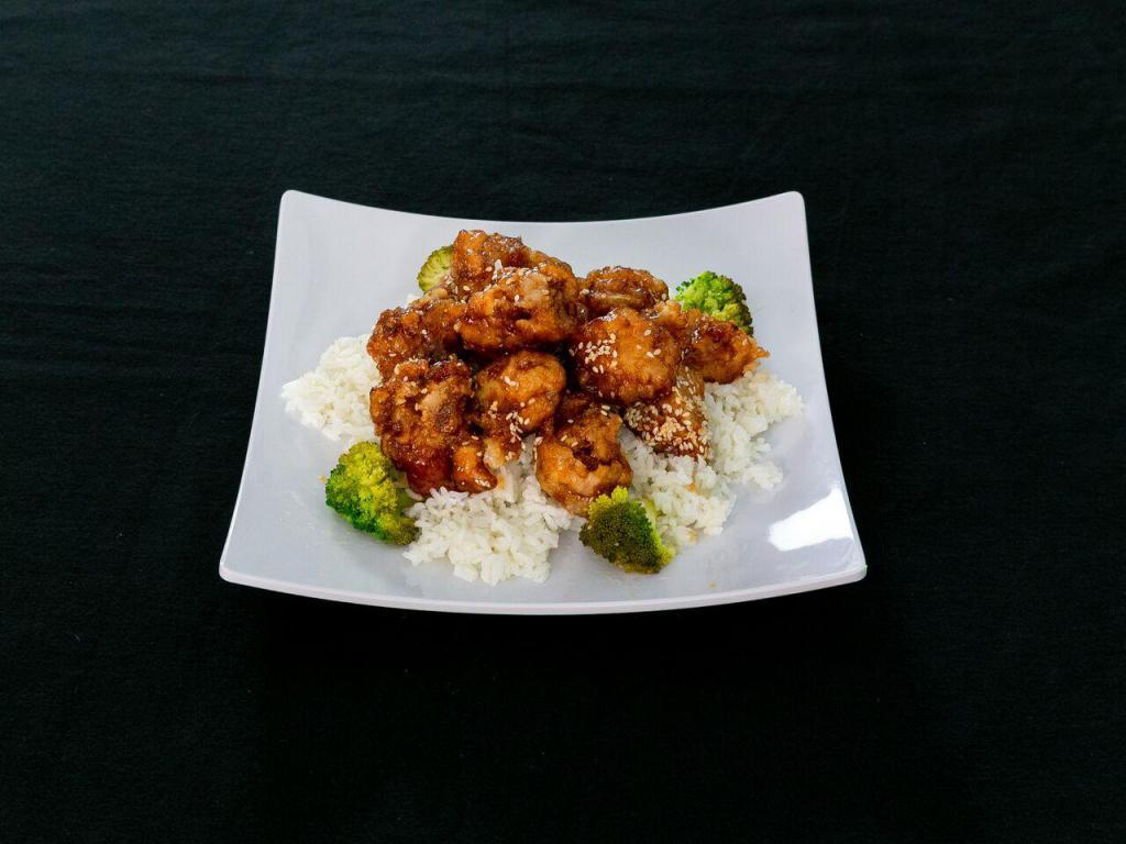 47. Sesame Chicken · Chunks of chicken sauteed in sweet sauce with sesame topping. Served with broccoli on the side.