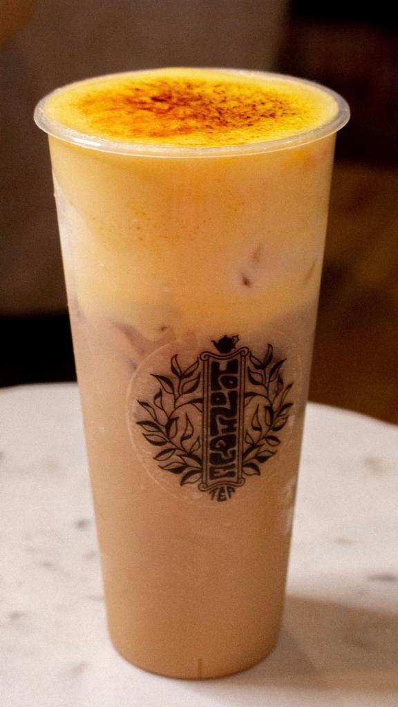 Toasted Creme Milk Tea · Black roasted Oolong tea with ours special custard creme brulee foam on top