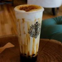 Creme Brulee Boba · Milk drink drizzled with brown sugar, paired with boba drenched in brown sugar and honey, an...