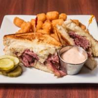 Pastrami Sandwich · Thinly sliced homemade pastrami stacked on rye.