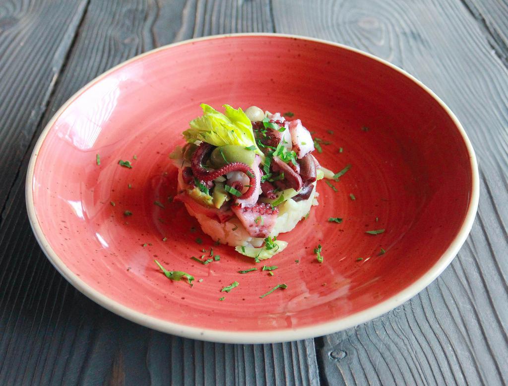 Octopus with potatoes · Octopus salad with potatoes, olives, celery and lemon dressing.