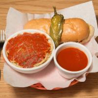 Italian Dip · Sausage sandwich topped with mozzarella cheese and chiles. Served with a side of spaghetti a...