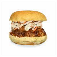 Southern BBQ Chicken Sandwich · Shredded rotisserie chicken smothered in BBQ sauce and topped with our own coleslaw.
