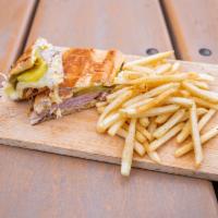 Cubano Sandwich · Ham, pulled pork, Swiss cheese, mustard, and pickles served with fries.