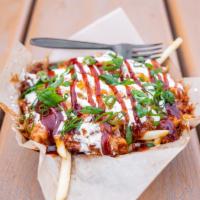 Loaded Pulled Pork Fries · BBQ pulled pork, shredded cheese, sour cream, and green onions on fries.