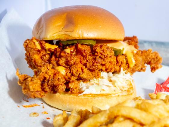 Crispy Hot Chicken Sandwich · Buttermilk fried chicken, coleslaw, pickles, on a brioche bun with fries. Add cheese sauce for an additional charge.