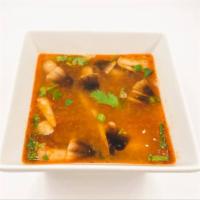 Tom-Yum Soup · Thai classic spicy lemon grass soup and mushrooms topped with cilantro, green onions.