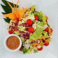 Thai Salad · Mixed greens, carrots, tomatoes , cucumber and red onions. Served with a peanut sauce.
