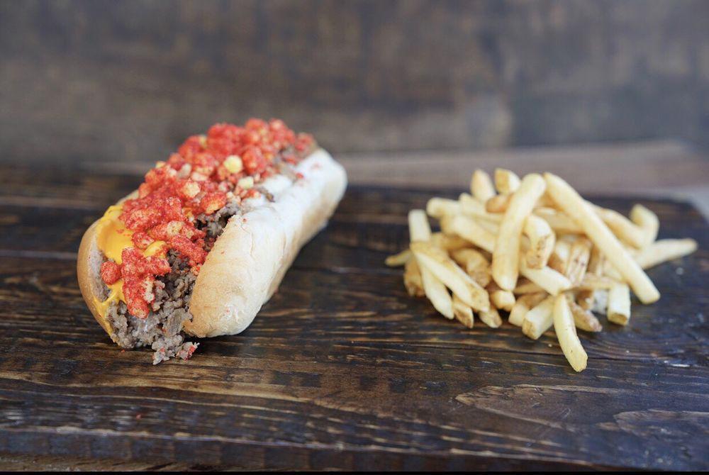Southpaw Hoagie · Cheesesteak, onions, american swiss blend, crushed flaming hot Cheetos, and cheese sauce.