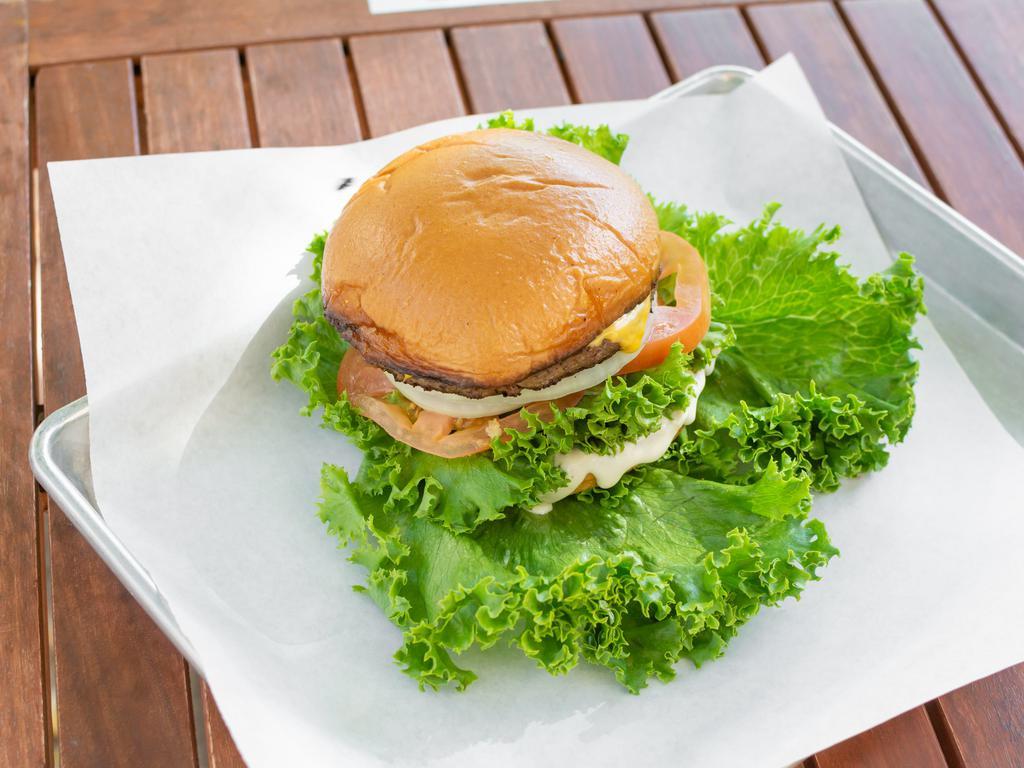 Cheeseburger · Lettuce, tomato, American cheese, onions and house sauce.