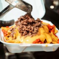 Nachos · Tacoworks chips and nacho cheese with your choice of asada(beef) or carnitas(pork) 