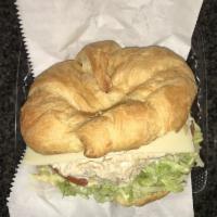 17. Chicken Salad Supreme Sandwich · Fresh chicken salad blended with walnuts and raisins and lettuce on a fresh baked croissant.
