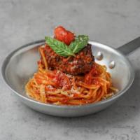 Spaghetti with Meatball · Spaghetti with tomato sauce and a large homemade meatball.