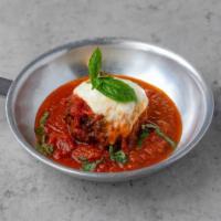 Homemade Meatball · One homemade meatball topped with mozzarella cheese and tomato sauce.