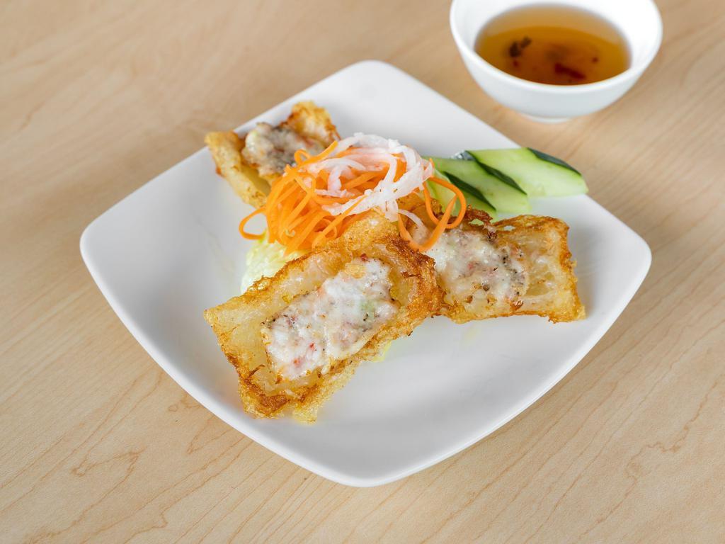 4. Cha Gio Re Tom · Crispy shrimp rolls. Extra crispy shrimp rolls with salad, cucumber, basil served with house special sauce.
