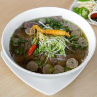 9. Pho Bo Nhan Sam Hoa Ky · House special pho beef soup with American ginseng, rare rib eye steak, well-done flank, bris...