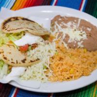 Gordita Dinner rice and beans · Fixed with Refried beans, lettuce, tomatoes, cheese and sour cream.